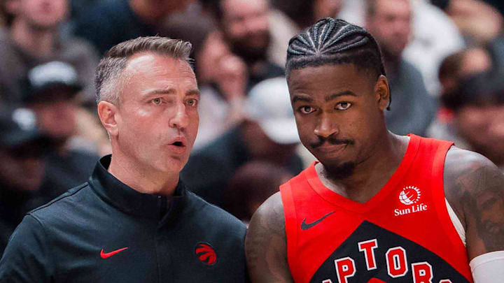 Toronto Raptors head coach Darko Rajakovic talks with guard Jamal Shead (23) against the Denver Nuggets in the second half at Rogers Arena. 