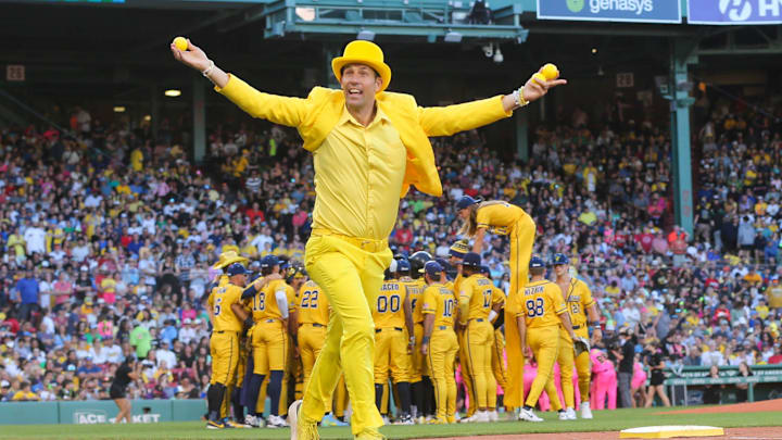 Team owner Jesse Cole runs toward the stands with shirts during the Savannah Bananas first Banana Ball game at Fenway Park on Saturday, June 8, 2024.