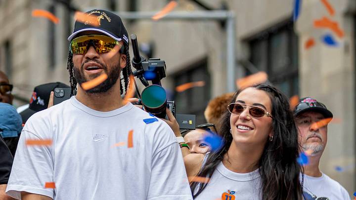 Jalen Brunson and Jalen's wife Ali ride a float during the New York Knicks Championship ticker tape parade. Jalen Brunson and Jalen's wife Ali ride a float during the New York Knicks Championship ticker tape parade.