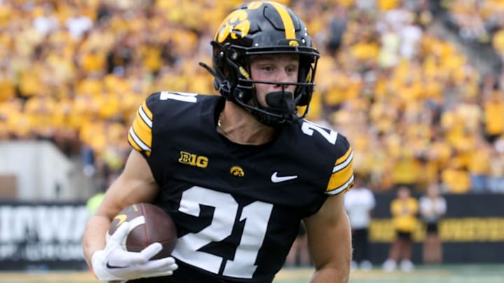 Iowa’s Kaden Wetjen (21) runs with the ball against Troy Saturday, Sept. 14, 2024 at Kinnick Stadium in Iowa City, Iowa.