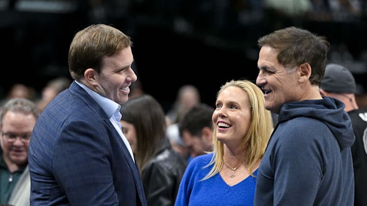 Feb 12, 2024; Dallas, Texas, USA; Dallas Mavericks governor Patrick Dumont (left) talks with Mark Cuban (right) during the first quarter of the game between the Mavericks and the Washington Wizards at the American Airlines Center. Mandatory Credit: Jerome Miron-Imagn Images