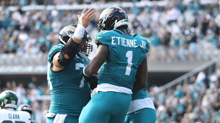 Dec 14, 2025; Jacksonville, Florida, USA; Jacksonville Jaguars running back Travis Etienne Jr. (1) reacts after scoring a touchdown during the second quarter against the New York Jets at EverBank Stadium. Mandatory Credit: Morgan Tencza-Imagn Images Dec 14, 2025; Jacksonville, Florida, USA; Jacksonville Jaguars running back Travis Etienne Jr. (1) reacts after scoring a touchdown during the second quarter against the New York Jets at EverBank Stadium. Mandatory Credit: Morgan Tencza-Imagn Images