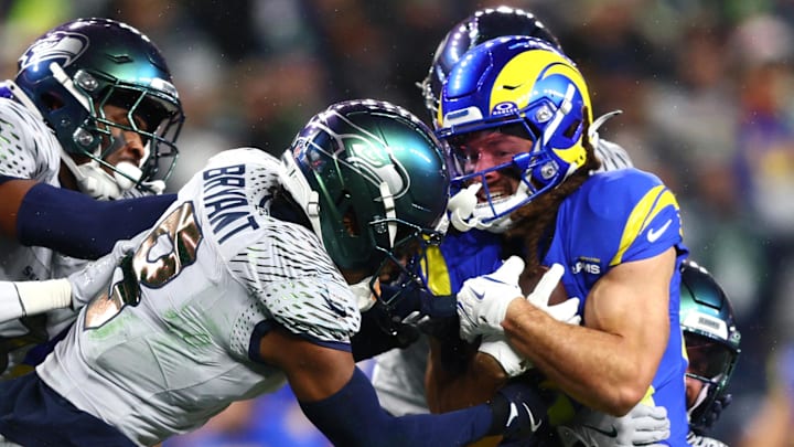 Dec 18, 2025; Seattle, Washington, USA; Seattle Seahawks safety Coby Bryant (8) tackles Los Angeles Rams wide receiver Jordan Whittington (88) in the first half at Lumen Field. Mandatory Credit: Kevin Ng-Imagn Images