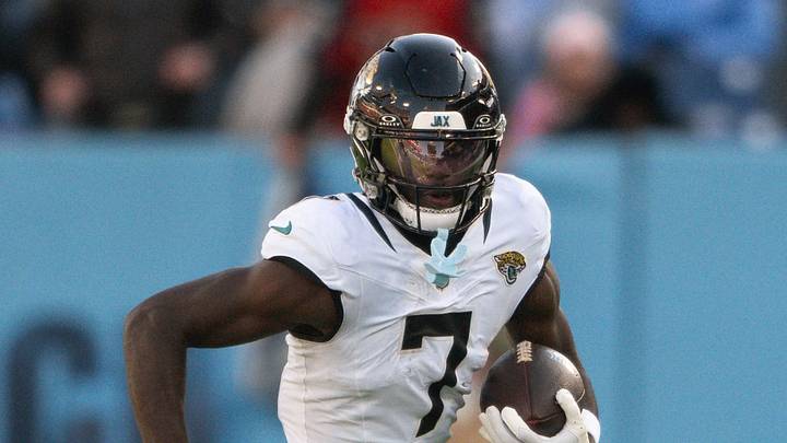 Nov 30, 2025; Nashville, Tennessee, USA;  Jacksonville Jaguars wide receiver Brian Thomas Jr. (7) runs with the ball after a made catch against the Tennessee Titans during the second half at Nissan Stadium. 