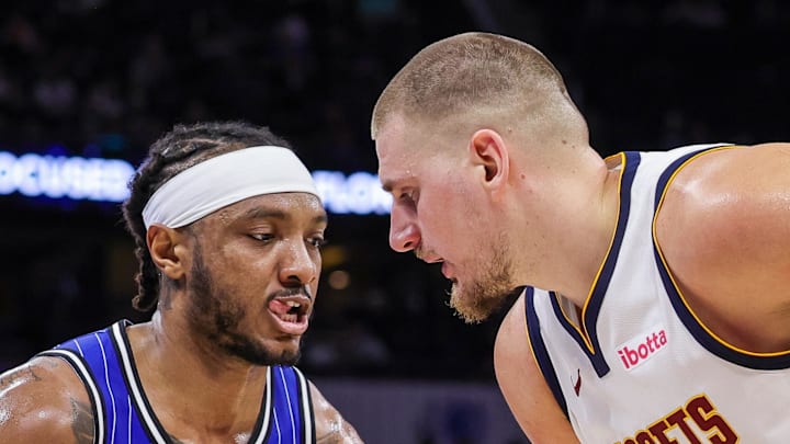 Orlando Magic center Wendell Carter Jr. defends Denver Nuggets center Nikola Jokic.