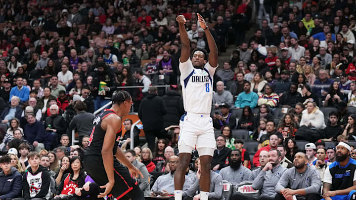 Dec 7, 2024; Toronto, Ontario, CAN; Dallas Mavericks forward Olivier-Maxence Prosper (8) shoots the ball at the basket over Toronto Raptors forward Scottie Barnes (4) during the second quarter at Scotiabank Arena. Mandatory Credit: Nick Turchiaro-Imagn Images Dec 7, 2024; Toronto, Ontario, CAN; Dallas Mavericks forward Olivier-Maxence Prosper (8) shoots the ball at the basket over Toronto Raptors forward Scottie Barnes (4) during the second quarter at Scotiabank Arena. Mandatory Credit: Nick Turchiaro-Imagn Images