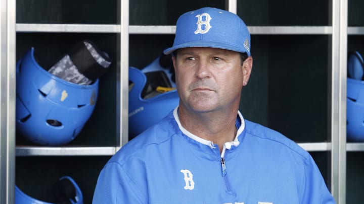 Jun 24, 2013; Omaha, NE, USA; UCLA Bruins head coach John Savage (22) looks on in the dugout before game 1 of the College World Series finals against the Mississippi State Bulldogs at TD Ameritrade Park. Mandatory Credit: Bruce Thorson-Imagn Images