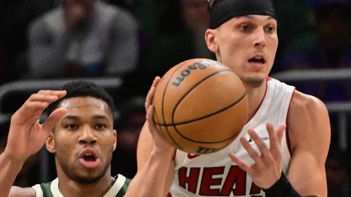 Oct 30, 2023; Milwaukee, Wisconsin, USA; Miami Heat guard Tyler Herro (14) grabs a rebound against Milwaukee Bucks forward Giannis Antetokounmpo (34) in the first quarter at Fiserv Forum. Mandatory Credit: Benny Sieu-Imagn Images Oct 30, 2023; Milwaukee, Wisconsin, USA; Miami Heat guard Tyler Herro (14) grabs a rebound against Milwaukee Bucks forward Giannis Antetokounmpo (34) in the first quarter at Fiserv Forum. Mandatory Credit: Benny Sieu-Imagn Images