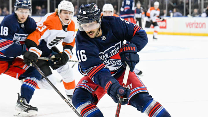 Apr 9, 2025; New York, New York, USA;  New York Rangers center Vincent Trocheck (16) plays the loose puck against the Philadelphia Flyers during the first period at Madison Square Garden. Mandatory Credit: Dennis Schneidler-Imagn Images