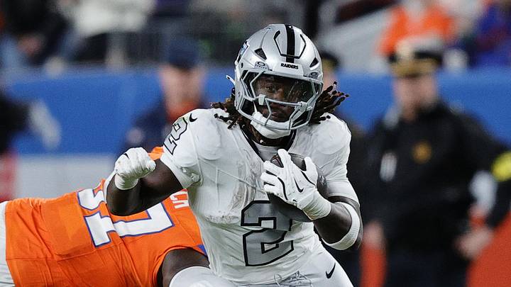 Nov 6, 2025; Denver, Colorado, USA; Las Vegas Raiders running back Ashton Jeanty (2) rushes the ball against the Denver Broncos during the first half at Empower Field at Mile High. Mandatory Credit: Isaiah J. Downing-Imagn Images