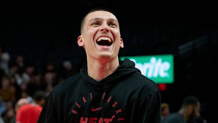Miami Heat guard Tyler Herro (14) laughs with teammates during warm ups before a game against the Portland Trail Blazers at Moda Center on January 11, 2025.