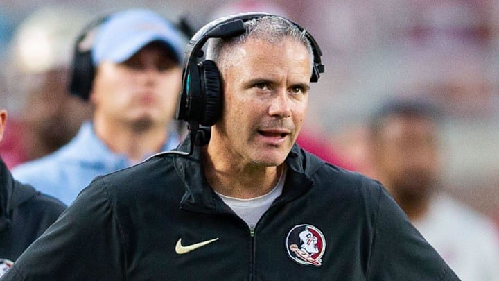 Florida State Seminoles head coach Mike Norvell talks on his headset as he coaches from the sideline. The Florida State Seminoles defeated the Virginia Tech Hokies 39-17 at Doak Campbell Stadium on Saturday, Oct. 7, 2023. Florida State Seminoles head coach Mike Norvell talks on his headset as he coaches from the sideline. The Florida State Seminoles defeated the Virginia Tech Hokies 39-17 at Doak Campbell Stadium on Saturday, Oct. 7, 2023.