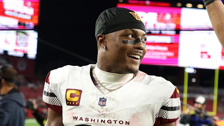 Jan 12, 2025; Tampa, Florida, USA; Washington Commanders wide receiver Terry McLaurin (17) and linebacker Bobby Wagner (54) celebrate after winning a NFC wild card playoff against the Tampa Bay Buccaneers at Raymond James Stadium. Mandatory Credit: Nathan Ray Seebeck-Imagn Images