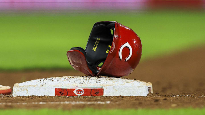 The helmet and sliding glove of Cincinnati Reds catcher Tyler Stephenson