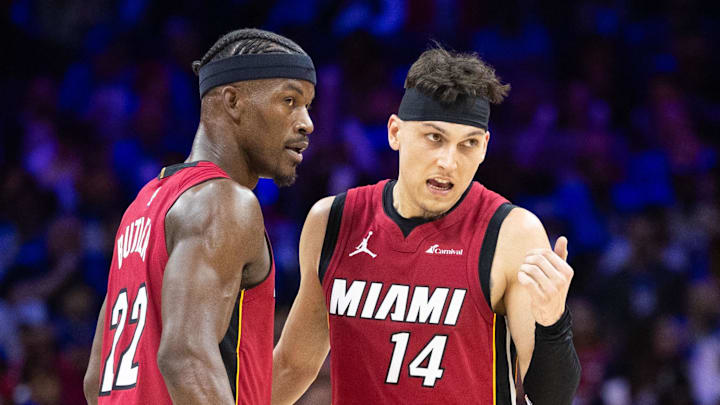 Apr 17, 2024; Philadelphia, Pennsylvania, USA; Miami Heat forward Jimmy Butler (22) and guard Tyler Herro (14) talk as Philadelphia 76ers center Joel Embiid (21) stands behind during the third quarter of a play-in game of the 2024 NBA playoffs at Wells Fargo Center. Mandatory Credit: Bill Streicher-Imagn Images Apr 17, 2024; Philadelphia, Pennsylvania, USA; Miami Heat forward Jimmy Butler (22) and guard Tyler Herro (14) talk as Philadelphia 76ers center Joel Embiid (21) stands behind during the third quarter of a play-in game of the 2024 NBA playoffs at Wells Fargo Center. Mandatory Credit: Bill Streicher-Imagn Images