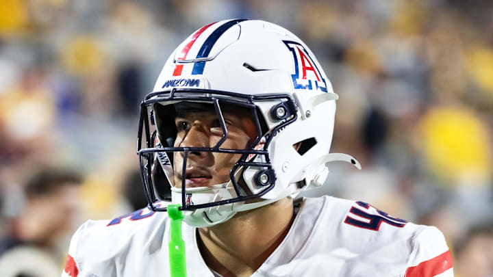 Nov 28, 2025; Tempe, Arizona, USA; Arizona Wildcats defensive lineman Dominic Lolesio (42) against the Arizona State Sun Devils during the 99th Territorial Cup at Mountain America Stadium. Mandatory Credit: Mark J. Rebilas-Imagn Images