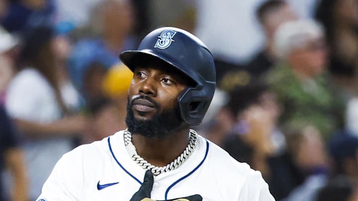Seattle Mariners left fielder Randy Arozarena (56) reacts after hitting a three-run home run against the San Diego Padres during the fifth inning at T-Mobile Park on Aug. 26. Seattle Mariners left fielder Randy Arozarena (56) reacts after hitting a three-run home run against the San Diego Padres during the fifth inning at T-Mobile Park on Aug. 26.