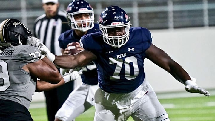 Denton Ryan offensive lineman Ty Haywood (70) delivers a block during a 2023 game.