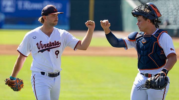 Virginia Cavaliers pitcher Henry Zatkowski (9) and catcher Jake Weatherspoon (16) walk off the field after Zatkowski escapes the frame. Virginia Cavaliers pitcher Henry Zatkowski (9) and catcher Jake Weatherspoon (16) walk off the field after Zatkowski escapes the frame.