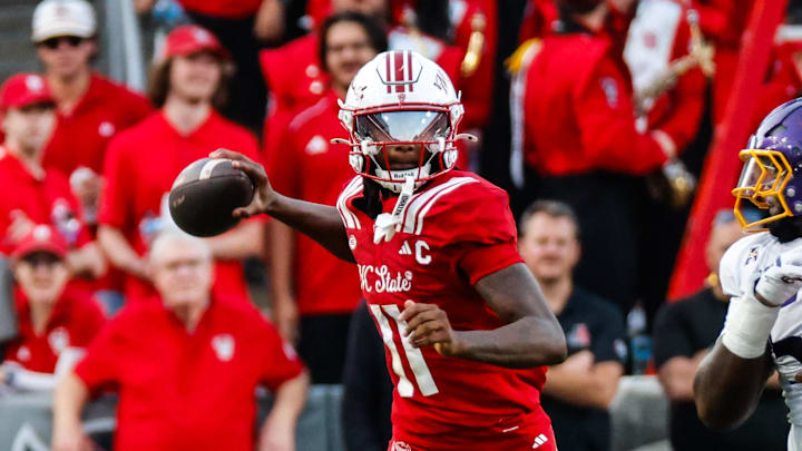 Aug 28, 2025; Raleigh, North Carolina, USA; North Carolina State Wolfpack quarterback CJ Bailey (11) prepares to throw the ball during the first half of the game against East Carolina Pirates at Carter-Finley Stadium. Mandatory Credit: Jaylynn Nash-Imagn Images Aug 28, 2025; Raleigh, North Carolina, USA; North Carolina State Wolfpack quarterback CJ Bailey (11) prepares to throw the ball during the first half of the game against East Carolina Pirates at Carter-Finley Stadium. Mandatory Credit: Jaylynn Nash-Imagn Images
