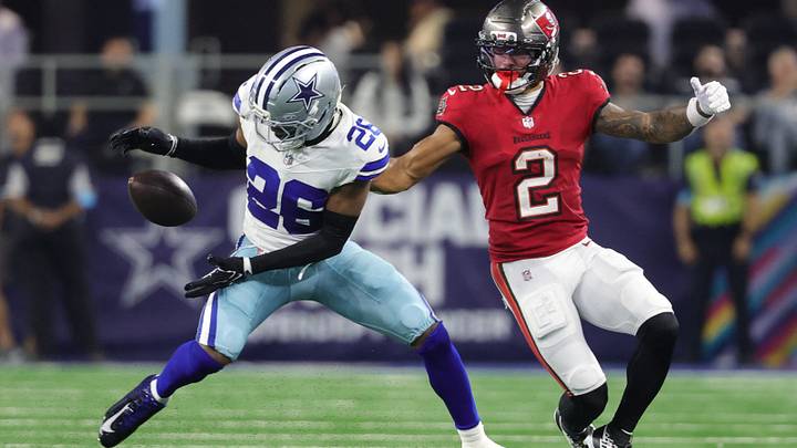 Dallas Cowboys CB DaRon Bland attempts to make an interception against Tampa Bay Buccaneers WR Emeka Egbuka. Dallas Cowboys CB DaRon Bland attempts to make an interception against Tampa Bay Buccaneers WR Emeka Egbuka.