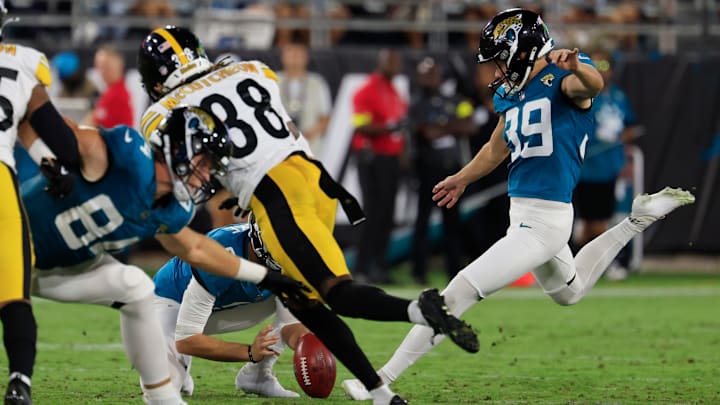 Jacksonville Jaguars place kicker Cam Little (39) kicks a 70-yard field goal as punter Logan Cooke (9) holds during the second quarter of an NFL preseason matchup at EverBank Stadium, Saturday, Aug. 9, 2025 in Jacksonville, Florida.