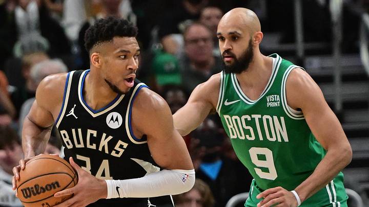 Apr 9, 2024; Milwaukee, Wisconsin, USA; Milwaukee Bucks forward Giannis Antetokounmpo (34) looks for a shot against Boston Celtics guard Derrick White (9) in the third quarter at Fiserv Forum. Mandatory Credit: Benny Sieu-Imagn Images