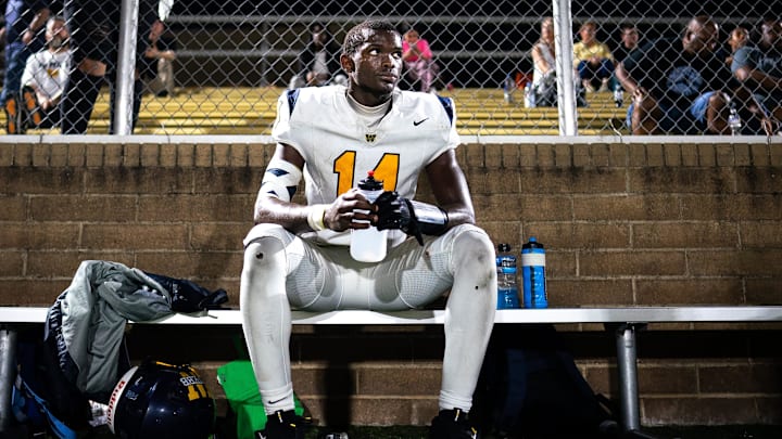 Webb’s Joel Wyatt (14) catches his breath on the sideline after scoring a touchdown against Pope John Paul II during the second half at Pope Saint John Paul II Preparatory School in Hendersonville, Tenn., Friday, Sept. 13, 2024.