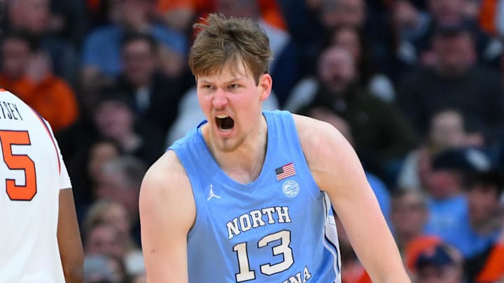 Feb 21, 2026; Syracuse, New York, USA; North Carolina Tar Heels center Henri Veesaar (13) reacts to a play past Syracuse Orange forward Tyler Betsey (5) during the second half at the JMA Wireless Dome. Mandatory Credit: Rich Barnes-Imagn Images