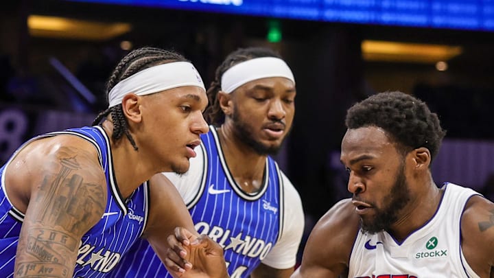 Detroit Pistons forward Paul Reed drives to the basket against Orlando Magic forward Paolo Banchero.