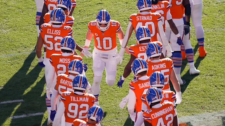Jan 5, 2025; Denver, Colorado, USA; Denver Broncos quarterback Bo Nix (10) runs out during player introductions before the game against the Kansas City Chiefs at Empower Field at Mile High. 
