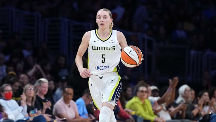 Aug 20, 2025; Los Angeles, California, USA; Dallas Wings guard Paige Bueckers (5) dribbles the ball against the LA Sparks in the first half at Crypto.com Arena. Mandatory Credit: Kirby Lee-Imagn Images
