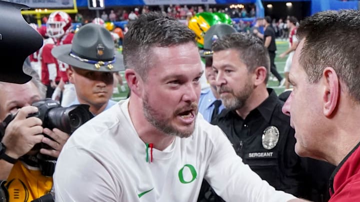 Indiana Hoosiers head coach Curt Cignetti shakes hands with Oregon Ducks head coach Dan Lanning on Friday, Jan. 9, 2026, after the Indiana Hoosiers defeated the Oregon Ducks in the Peach Bowl and semifinal game of the College Football Playoff at Mercedes-Benz Stadium in Atlanta. Indiana Hoosiers head coach Curt Cignetti shakes hands with Oregon Ducks head coach Dan Lanning on Friday, Jan. 9, 2026, after the Indiana Hoosiers defeated the Oregon Ducks in the Peach Bowl and semifinal game of the College Football Playoff at Mercedes-Benz Stadium in Atlanta.
