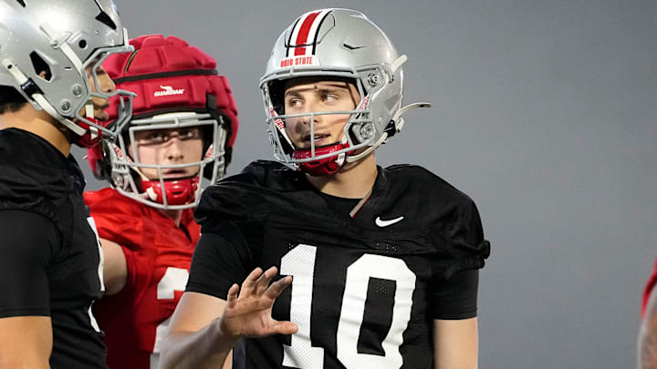 Ohio State Buckeyes quarterback Julian Sayin (10) talks to quarterback Tavien St. Clair (9) during spring football practice at the Woody Hayes Athletic Center on March 17, 2025.