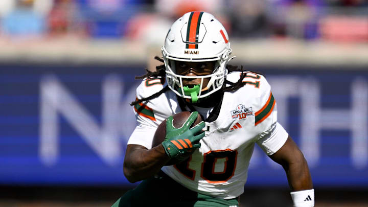 Nov 1, 2025; Dallas, Texas, USA;  Miami Hurricanes wide receiver Malachi Toney (10) runs with the ball against the SMU Mustangs during the second half at Gerald J. Ford Stadium. Mandatory Credit: Jerome Miron-Imagn Images