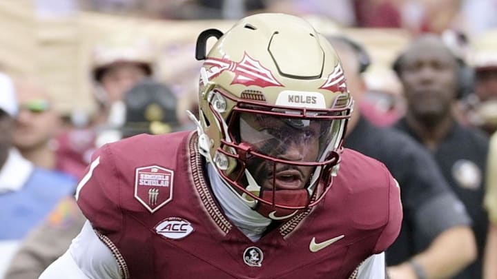 Aug 30, 2025; Tallahassee, Florida, USA; Florida State Seminoles quarterback Tommy Castellanos (1) runs for a touchdown against the Alabama Crimson Tide during the first half at Doak S. Campbell Stadium. Mandatory Credit: Melina Myers-Imagn Images