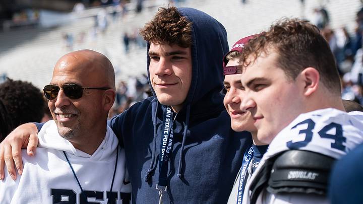 Penn State football head coach James Franklin takes a photo with recruit Luke Wafle and the Wafle family, including defensive tackle Owen Wafle (34), following the Blue-White game at Beaver Stadium on Saturday, April 26, 2025, in State College. The White team defeated the Blue team, 10-8.