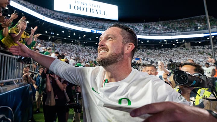 Oregon head coach Dan Lanning celebrates his win with Duck fans as the Oregon Ducks face the Penn State Nittany Lions on Sept. 27, 2025, at Beaver Stadium in University Park, Pennsylvania.