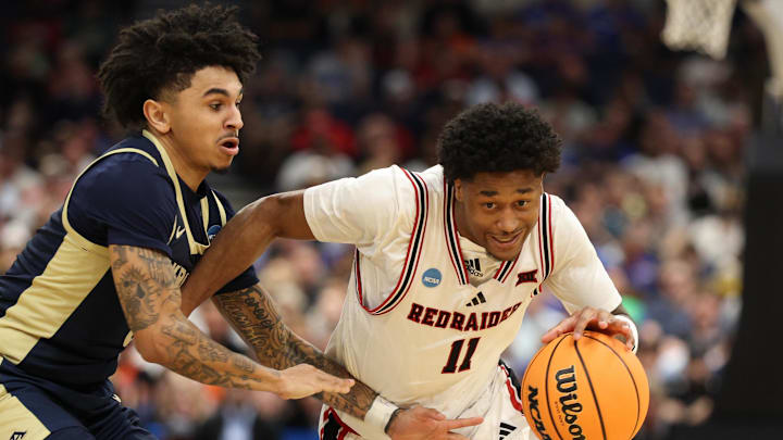 Texas Tech Red Raiders guard Jaylen Petty (11) drives against Akron Zips guard Sharron Young (3) in the second half during a first round game of the men's 2026 NCAA Tournament at Benchmark International Arena. Texas Tech Red Raiders guard Jaylen Petty (11) drives against Akron Zips guard Sharron Young (3) in the second half during a first round game of the men's 2026 NCAA Tournament at Benchmark International Arena.