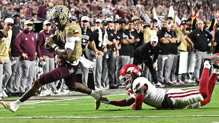 Texas A&M Aggies quarterback Marcel Reed (10) runs the ball for a touchdown during the second quarter against the Arkansas Razorbacks at Kyle Field. Texas A&M Aggies quarterback Marcel Reed (10) runs the ball for a touchdown during the second quarter against the Arkansas Razorbacks at Kyle Field.