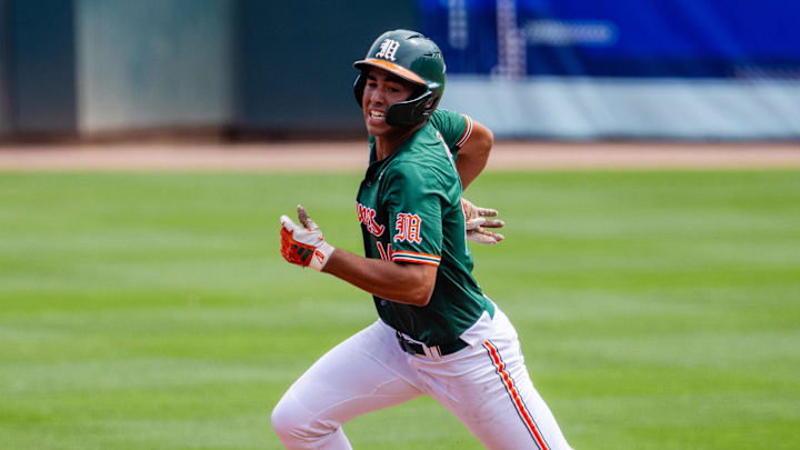 May 23, 2024; Charlotte, NC, USA; Miami (Fl) Hurricanes infielder Daniel Cuvet (14) heads to third against the Clemson Tigers in the second inning during the ACC Baseball Tournament at Truist Field. Mandatory Credit: Scott Kinser-Imagn Images
