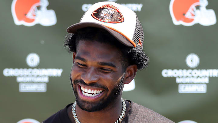 Cleveland Browns quarterback Shedeur Sanders (12) jokes about his signing bonus during a press conference before day two of NFL rookie minicamp at the Cleveland Browns training facility on Saturday, May 10, 2025, in Berea, Ohio.