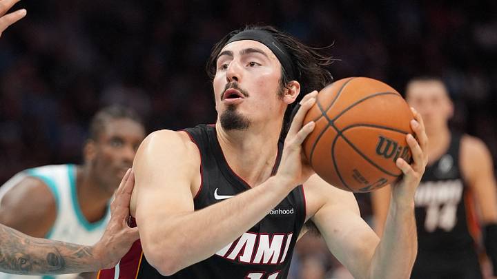 Apr 14, 2026; Charlotte, North Carolina, USA; Miami Heat guard Jaime Jaquez Jr. (11) handles the ball against Charlotte Hornets forward Miles Bridges (0) during the second quarter during the play-in rounds between the Charlotte Hornets and the Miami Heat of the 2026 NBA Playoffs at Spectrum Center. Mandatory Credit: Jim Dedmon-Imagn Images