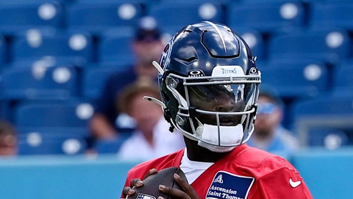 Tennessee Titans quarterback Cam Ward drops back to pass. Tennessee Titans quarterback Cam Ward drops back to pass.