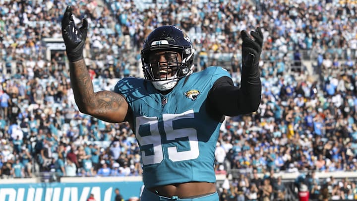 Nov 16, 2025; Jacksonville, Florida, USA; Jacksonville Jaguars defensive end BJ Green II (95) celebrates an interception by teammate against the Los Angeles Chargers during the fourth quarter at EverBank Stadium. Mandatory Credit: Morgan Tencza-Imagn Images Nov 16, 2025; Jacksonville, Florida, USA; Jacksonville Jaguars defensive end BJ Green II (95) celebrates an interception by teammate against the Los Angeles Chargers during the fourth quarter at EverBank Stadium. Mandatory Credit: Morgan Tencza-Imagn Images