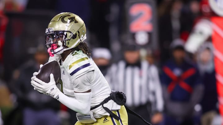 Nov 29, 2024; Athens, Georgia, USA; Georgia Tech Yellow Jackets wide receiver Eric Singleton Jr. (2) runs after a catch against the Georgia Bulldogs in the third quarter at Sanford Stadium. Mandatory Credit: Brett Davis-Imagn Images