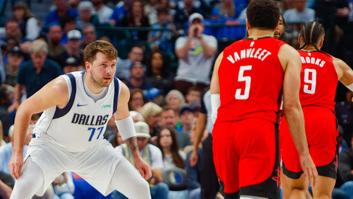 Apr 7, 2024; Dallas, Texas, USA; Dallas Mavericks guard Luka Doncic (77) guards Houston Rockets guard Fred VanVleet (5) during the second quarter at American Airlines Center. Mandatory Credit: Andrew Dieb-Imagn Images