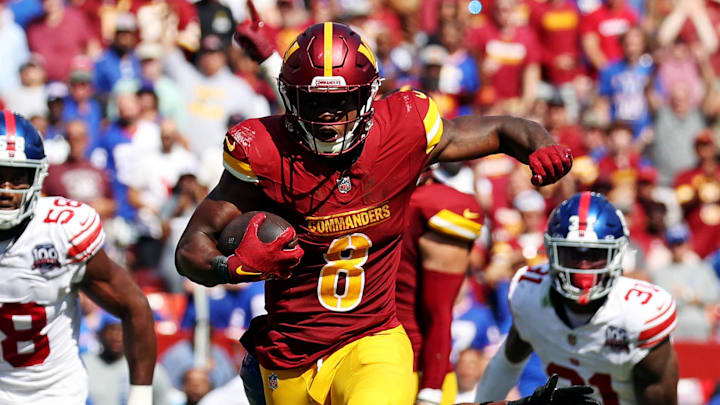 Sep 15, 2024; Landover, Maryland, USA; Washington Commanders running back Brian Robinson Jr. (8) runs the ball during the third quarter against the New York Giants at Commanders Field. Mandatory Credit: Peter Casey-Imagn Images Sep 15, 2024; Landover, Maryland, USA; Washington Commanders running back Brian Robinson Jr. (8) runs the ball during the third quarter against the New York Giants at Commanders Field. Mandatory Credit: Peter Casey-Imagn Images