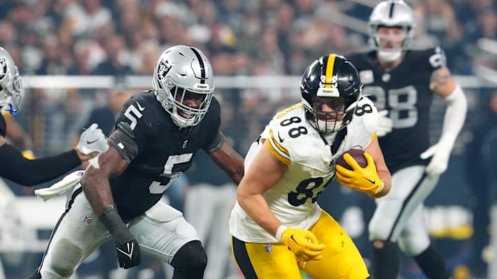 Sep 24, 2023; Paradise, Nevada, USA; Pittsburgh Steelers tight end Pat Freiermuth (88) runs ahead of Las Vegas Raiders linebacker Divine Deablo (5) and Las Vegas Raiders safety Marcus Epps (1) during the third quarter at Allegiant Stadium. Mandatory Credit: Stephen R. Sylvanie-Imagn Images
