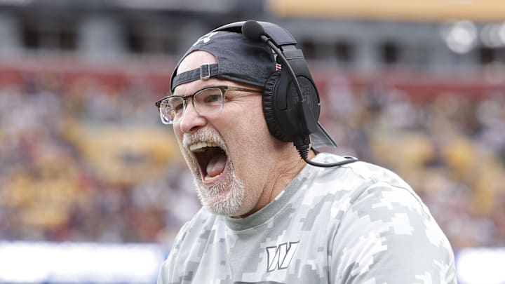 Nov 10, 2024; Landover, Maryland, USA; Washington Commanders head coach Dan Quinn celebrates on the sidelines after an interception pass against the Pittsburgh Steelers during the second half at Northwest Stadium. Mandatory Credit: Amber Searls-Imagn Images